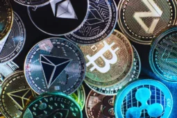 Criptomonedas representadas por monedas digitales con símbolos de varios criptoactivos.